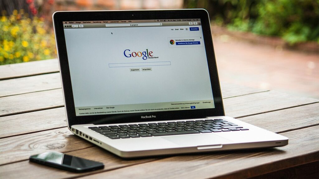 A laptop showing the Google search engine landing page.