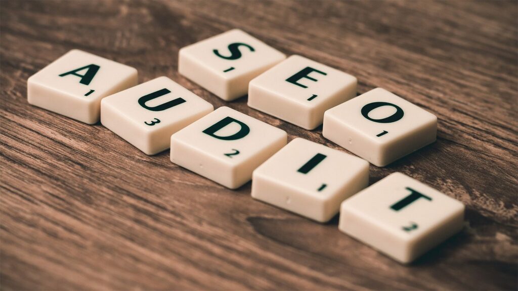The word "SEO Audit" formed from scrabbly squares for SEO strategies.